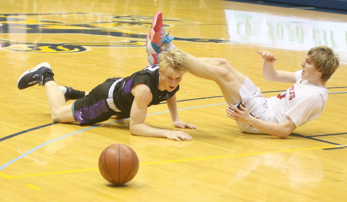 Carlsbad's Toby Harris and SFC's Hayden Gray hit the deck.