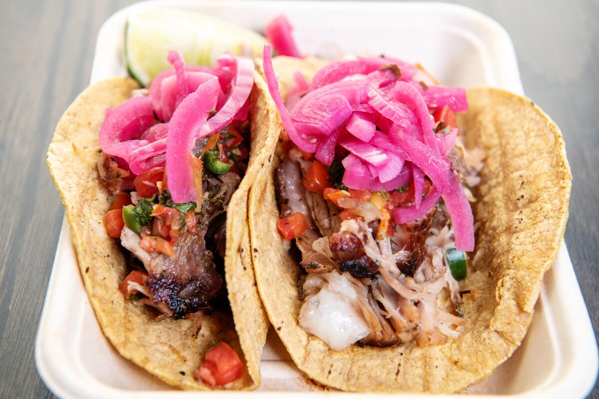 Tacos with pork and pickled red onions