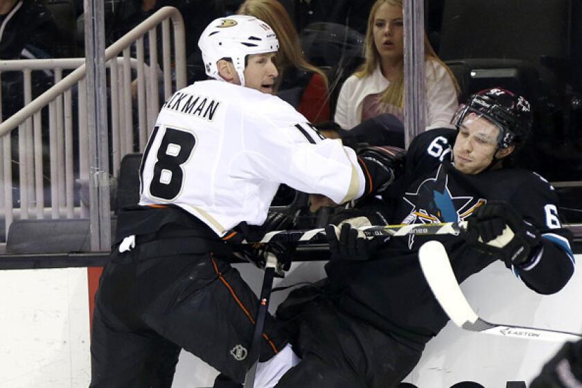 Ducks forward Tim Jackman checks Sharks defenseman Justin Braun along the boards in a game last month in San Jose.