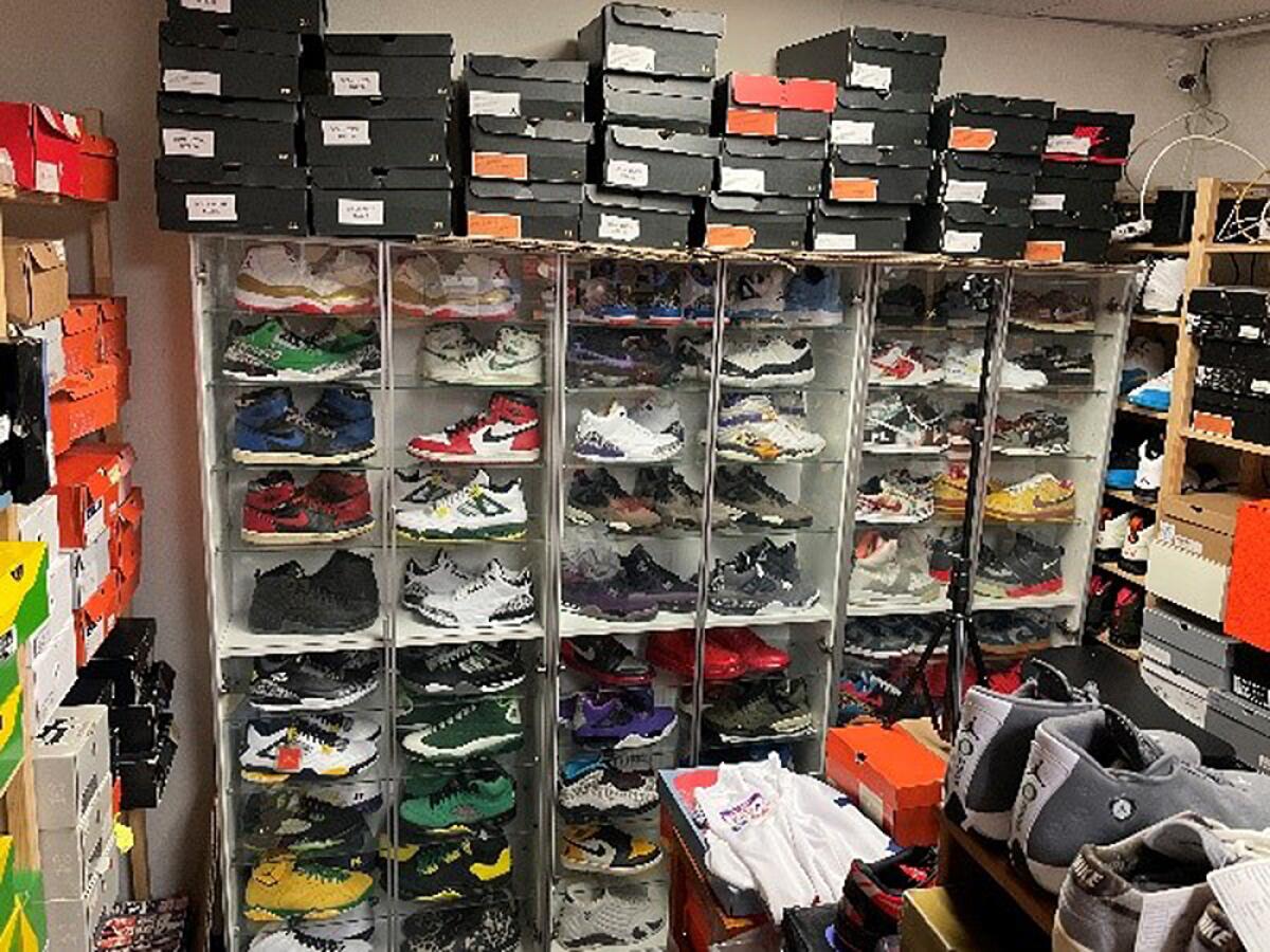 Nike shoes and clothing in a warehouse.