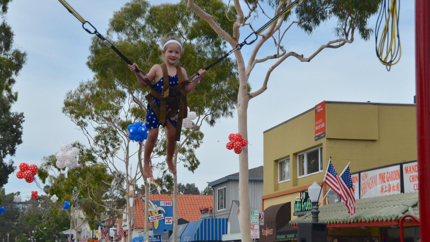 Tiegan Norton, 3, bungee jumped above Marine Ave. during Sunday's Balboa Island Carnival & Taste of the Island.