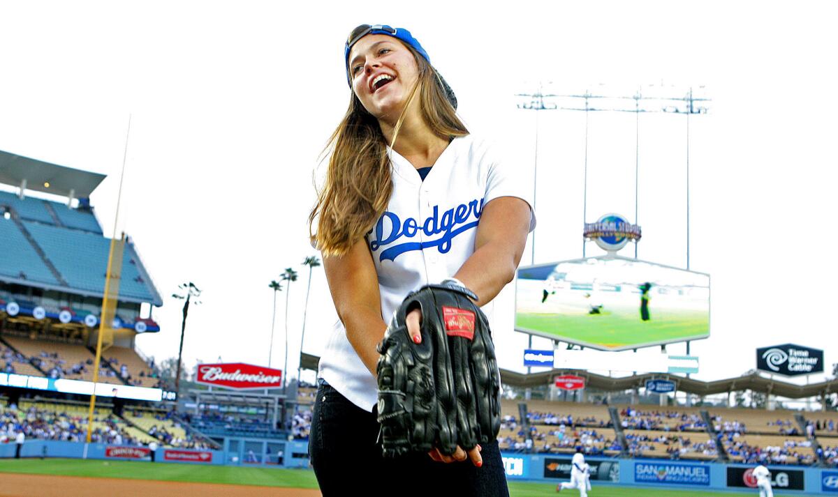 Olympian Kate Hansen, of La Cañada Flintridge, threw the ceremonial first pitch at Dodger Stadium on Thursday, April 17, 2014. She is now an in-game host for the Dodgers.