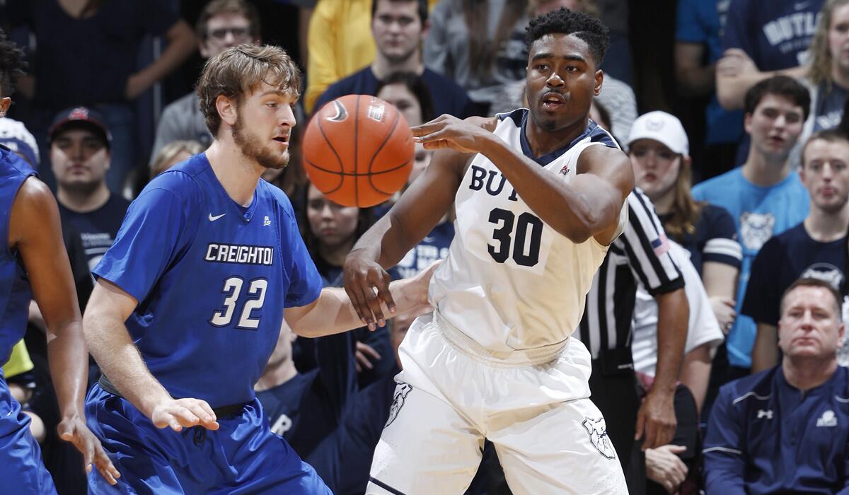 Butler's Kelan Martin (30) passes while defended by Creighton's Toby Hegner (32) in the second half on Tuesday.