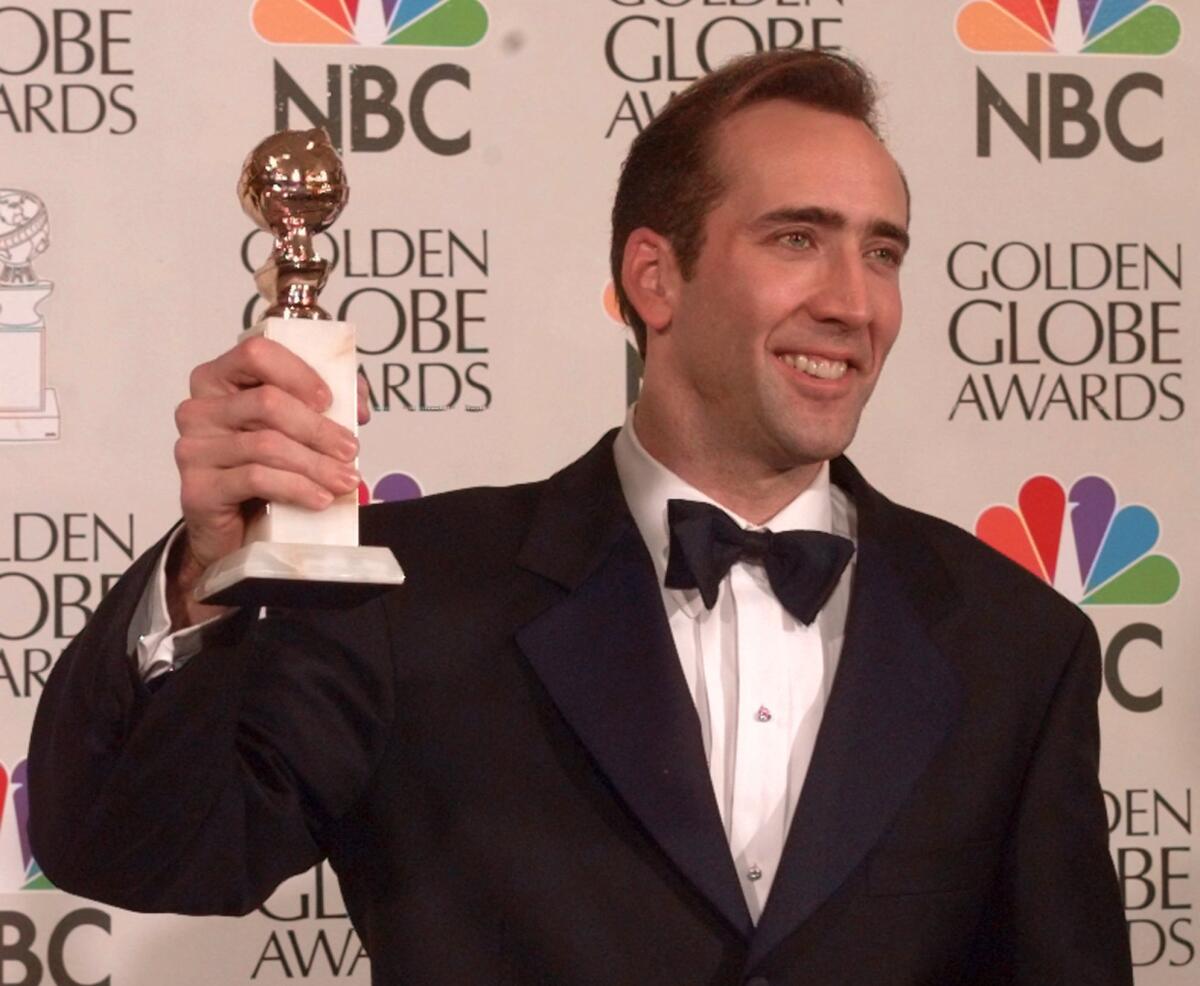 Nicolas Cage lifts the award for best actor in motion picture