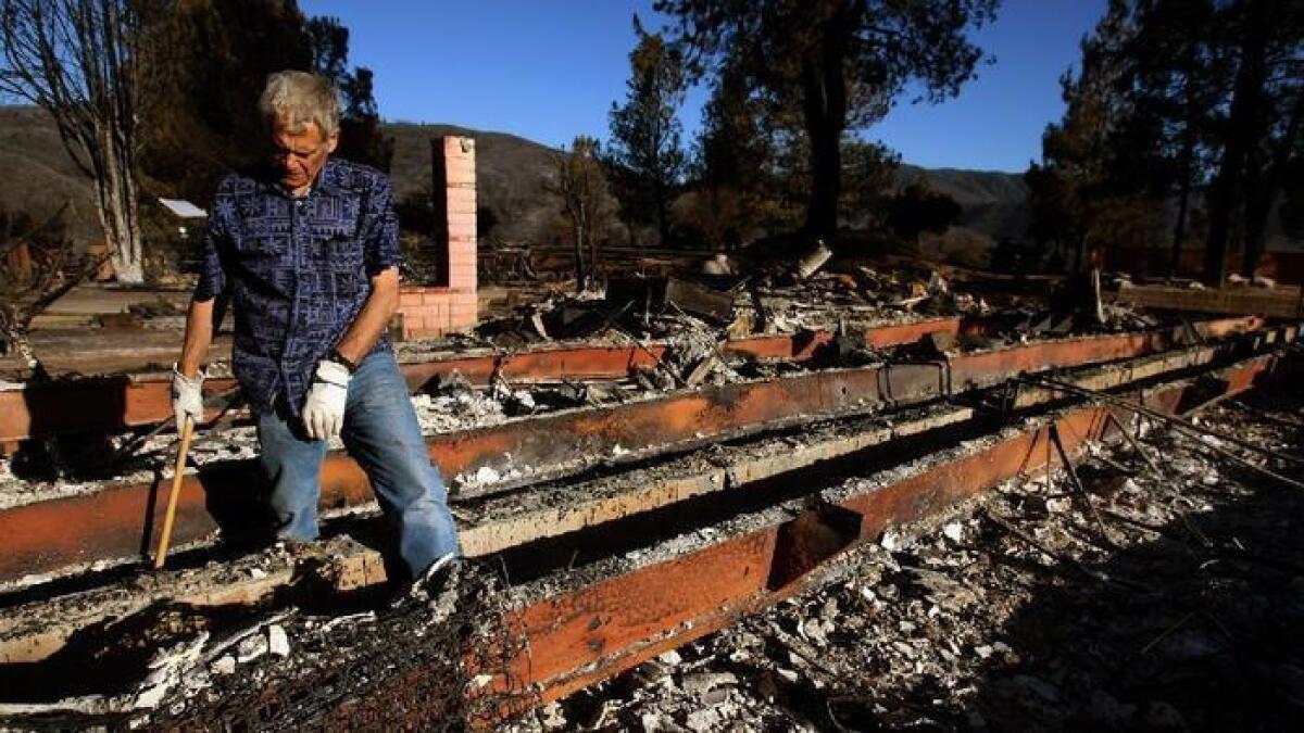 Joe Biviano, 63, returned for the first time to find his home burned to the ground by the Powerhouse fire on Sylvan Drive in Lake Hughes on June 3, 2013. "We lived here for 15 years, but lost 40 years of memories," Biviano said.