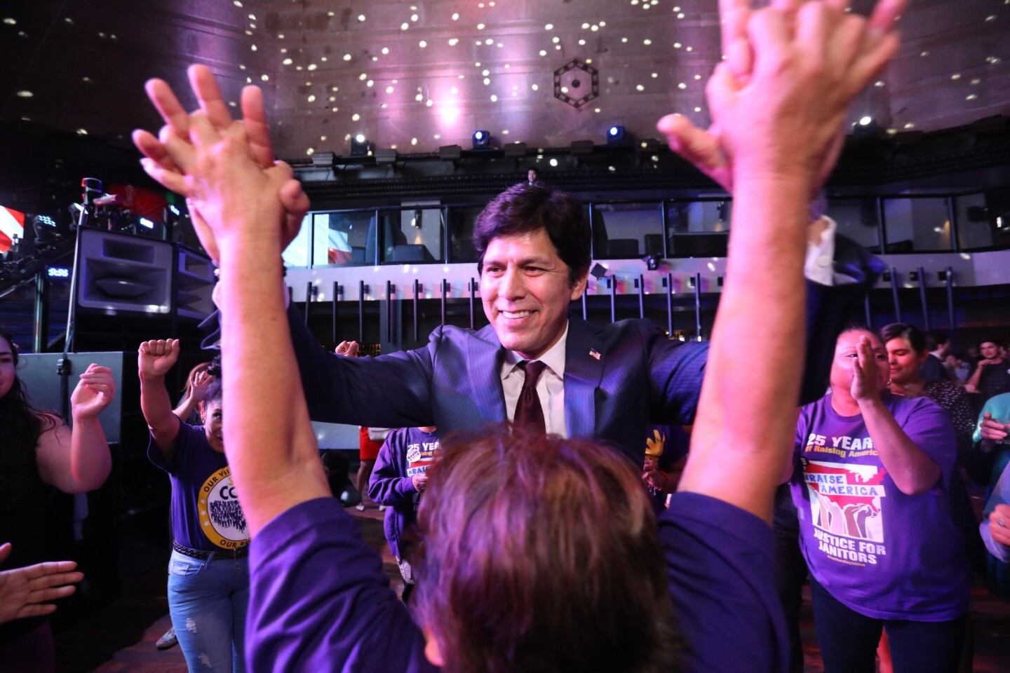 California Senator Kevin de Leon, California Democratic candidate for U.S. Senate, dances with supporters after giving his speech on election night at The Exchange in downtown Los Angeles.
