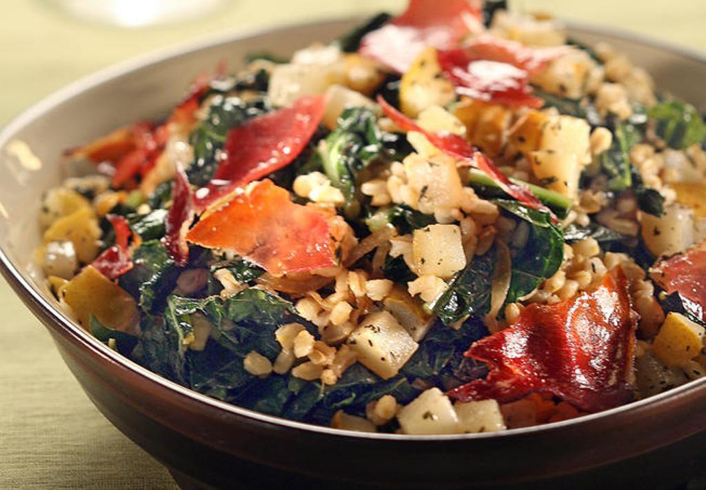 Warm barley and kale salad with roasted pears and candied prosciutto