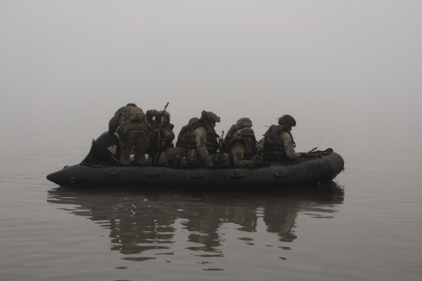 FILE - Ukrainian marines sail along the Dnipro river at the frontline near Kherson, Ukraine, Saturday, Oct. 14, 2023. A top Ukrainian official said on Wednesday, Nov. 15, 2023, its troops have established a beachhead on the eastern bank of the Dnieper River near Kherson, an important advance in bridging one of Russia's most significant strategic barriers in the war. (AP Photo/Alex Babenko, File)