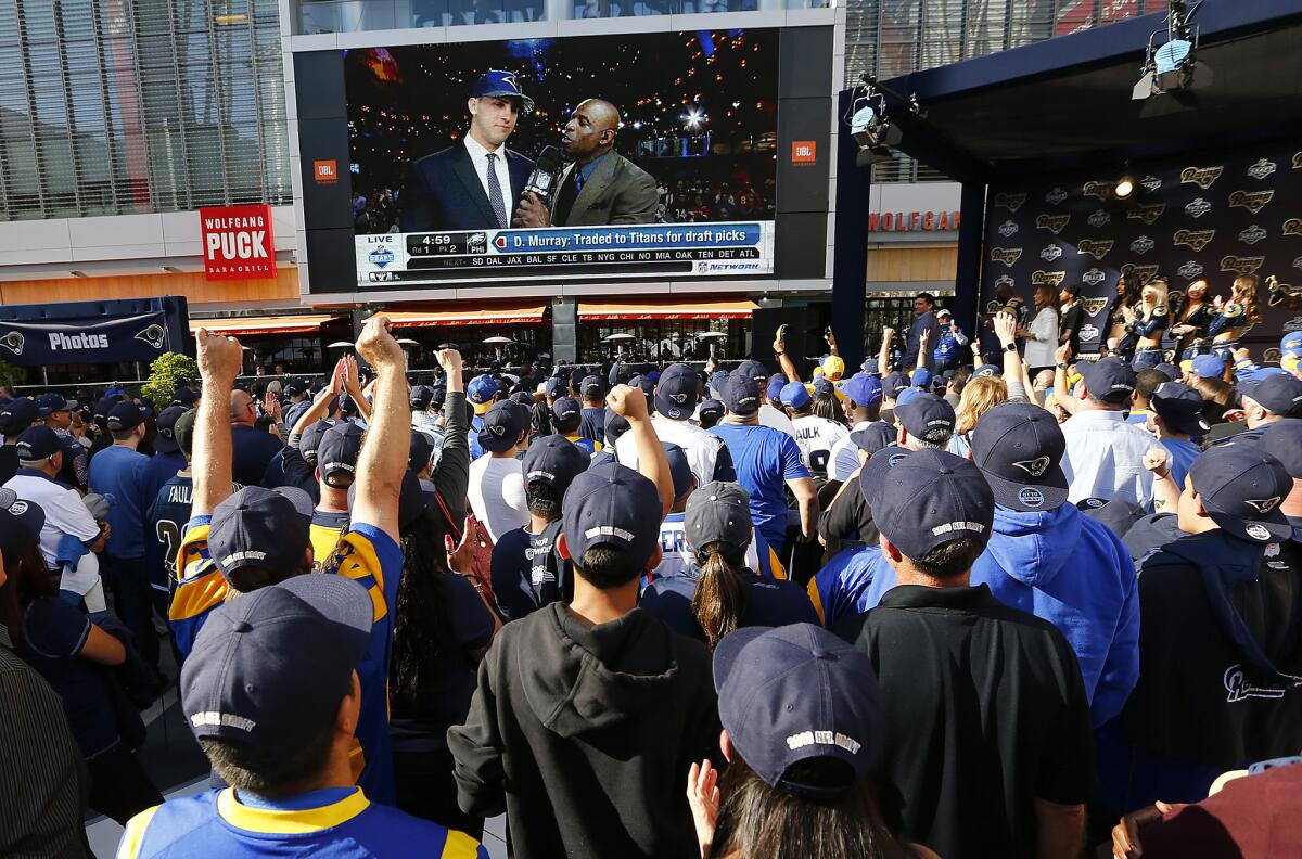 Rams fans in downtown L.A. react after the team selected California quarterback Jared Goff with the No. 1 overall selection in the NFL draft on Thursday.