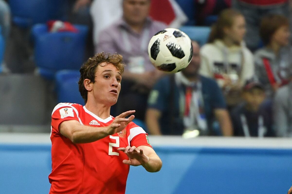 Russia's defender Mario Fernandes controls the ball during the Russia 2018 World Cup Group A football match between Russia and Egypt at the Saint Petersburg Stadium in Saint Petersburg on June 19, 2018.