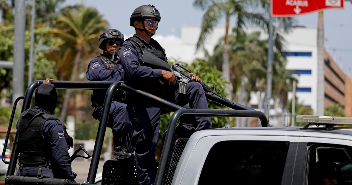 14 police officers killed in an ambush in Mexico, testing president's security strategy