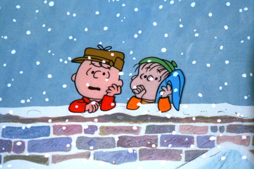 Charlie Brown, left, and Linus contemplate the meaning of the season in the 1965 animated special "A Charlie Brown Christmas," airing Thursday on ABC and streaming via Hulu.