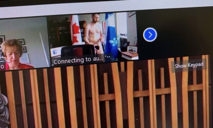 EDS NOTE: NUDITY - This screenshot obtained by The Canadian Press shows Liberal MP William Amos, top, naked in his office during a video conference call on Wednesday, April 14, 2021. Amos, who has represented the Quebec district of Pontiac since 2015, appeared on the screens of his fellow lawmakers completely naked and says his video was accidentally turned on as he was changing into his work clothes after going for a jog. (Canadian Parliament/The Canadian Press via AP)