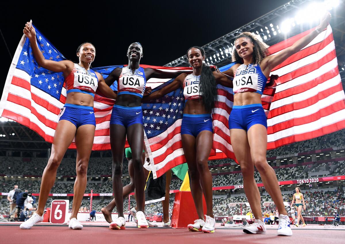 USA team members pose for photos after winning the gold medal.