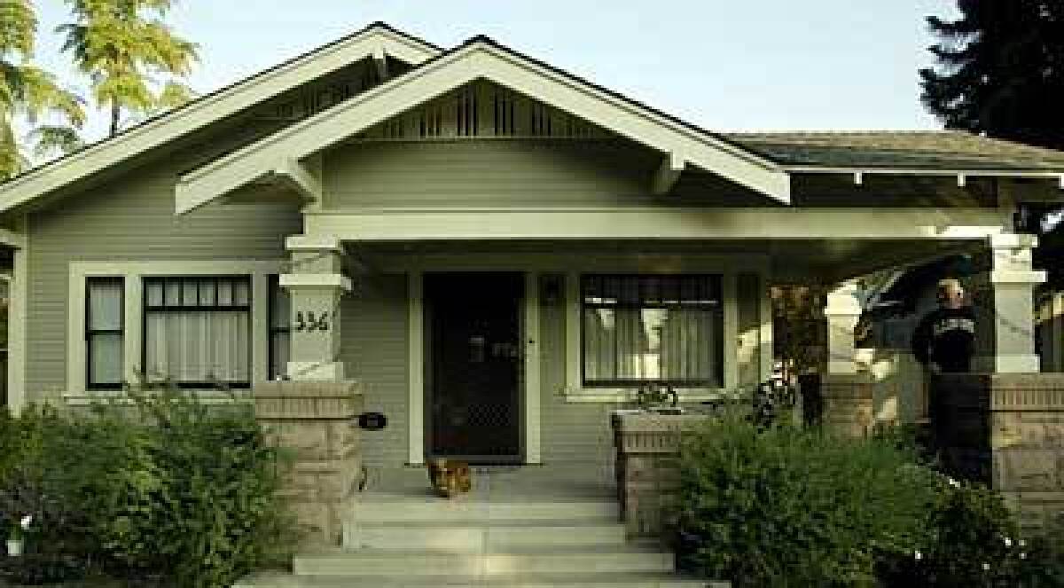 A plaque on this Craftsman house in Bluff Heights dates it to 1919.