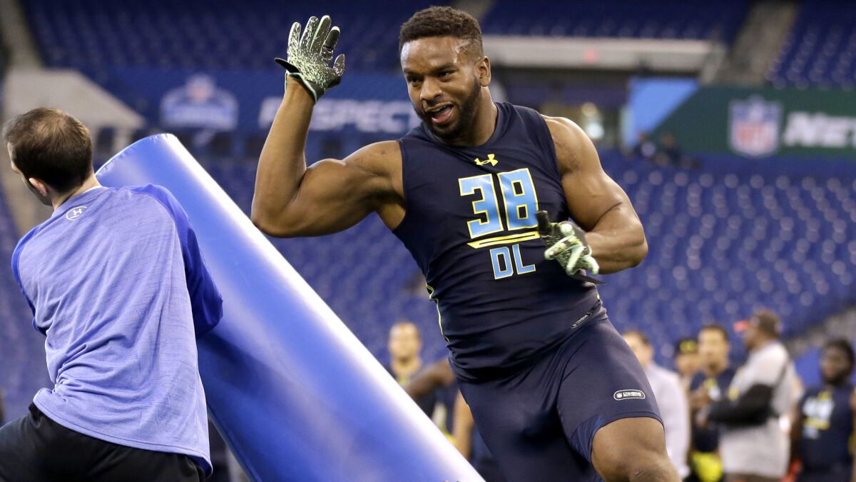 Pittsburgh defensive end Ejuan Price runs a drill at the NFL combine in March.