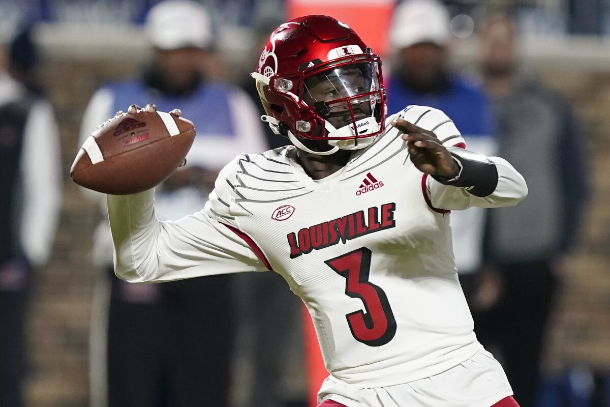Louisville quarterback Malik Cunningham (3) looks to pass against Duke during the first half of an NCAA college football game in Durham, N.C., Thursday, Nov. 18, 2021. (AP Photo/Gerry Broome)