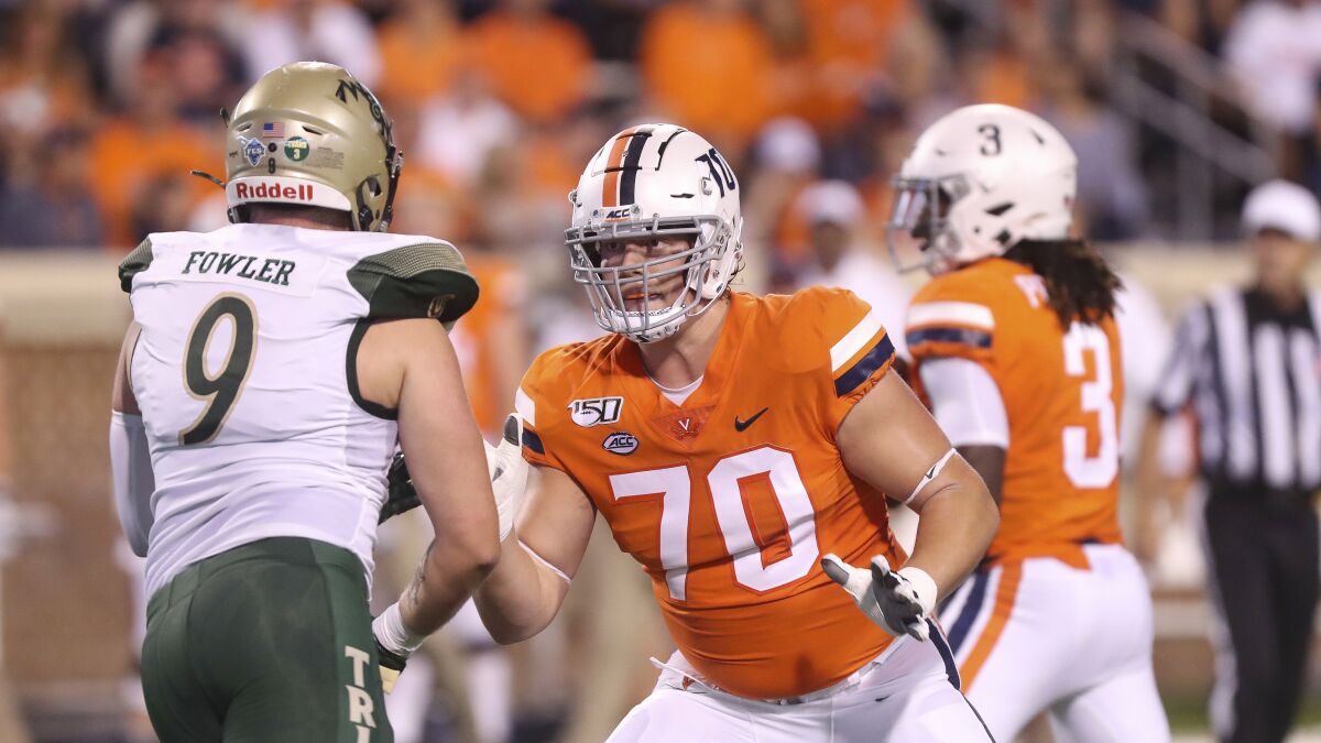Virginia offensive tackle Bobby Haskins (70) blocks during a game against William & Mary in 2019.