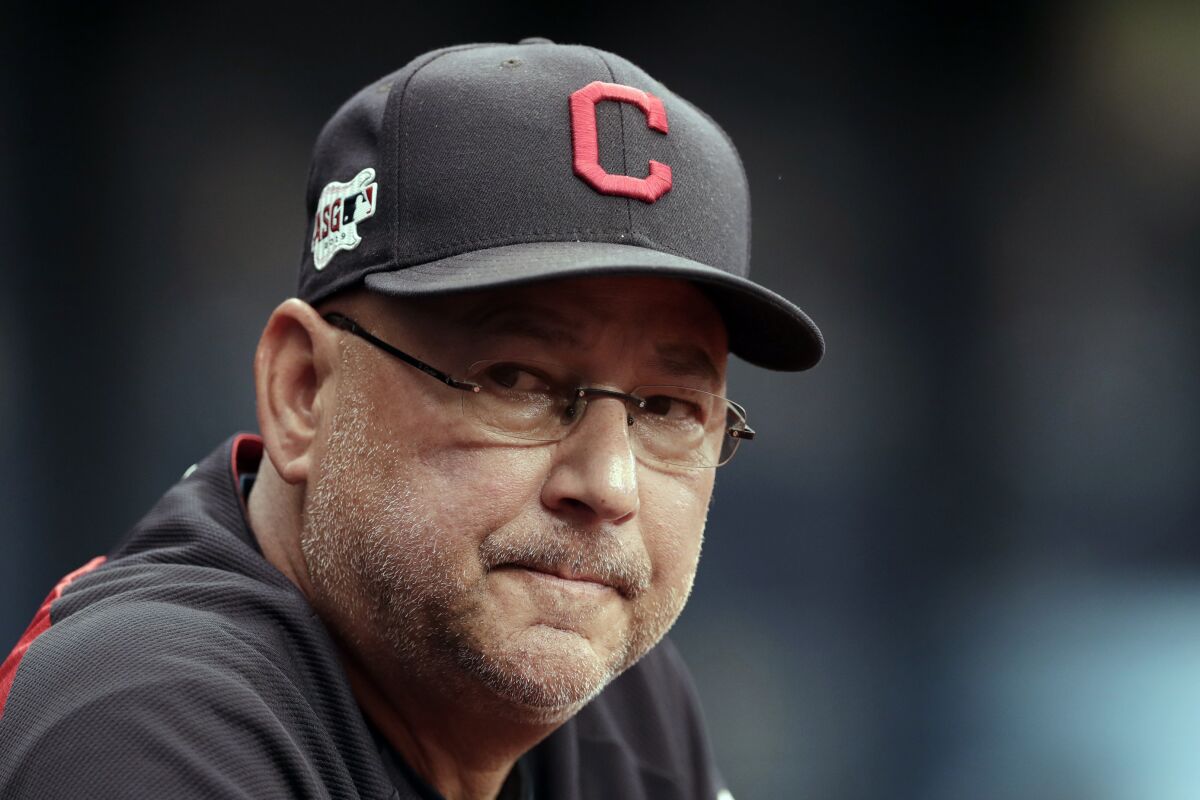 FILE - In this Sept. 1, 2019, file photo, Cleveland Indians manager Terry Francona watches during the first inning of a baseball game against the Tampa Bay Rays in St. Petersburg, Fla. The Cleveland Indians expect manager Terry Francona to return for the 2021 season after he missed 47 games this season due to health reasons. Team president Chris Antonetti said Tuesday, Oct. 6, 2020, that the 61-year Francona is back home in Arizona resting and recovering. Francona was hospitalized this season after undergoing surgery for a gastrointestinal issue and then dealing with blood clotting complications.(AP Photo/Chris O'Meara, File)