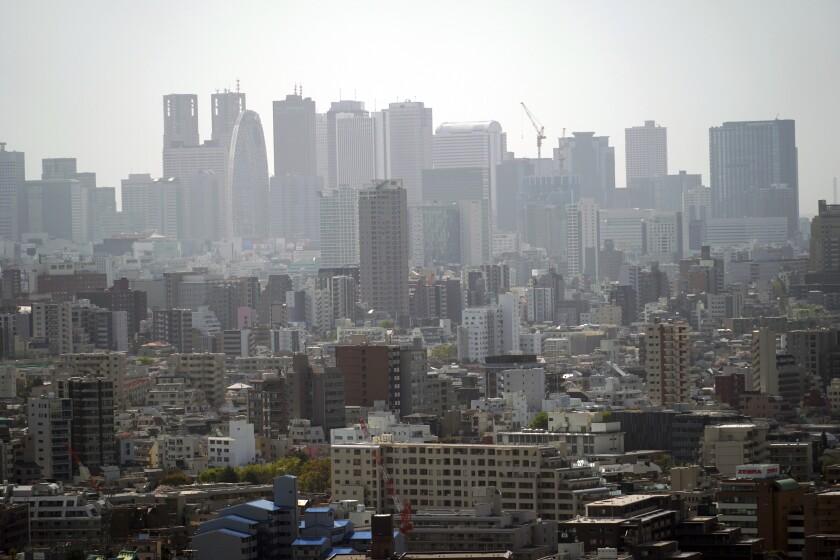 Landscape is seen in Tokyo on March 31, 2021. The Japanese economy contracted at an annual rate of 5.1% in January-March, slammed by a plunge in spending over the coronavirus pandemic, according to government data released Tuesday, May 18, 2021. (AP Photo/Eugene Hoshiko)