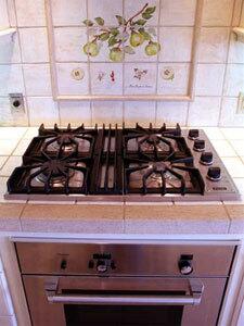 Decorative tiles in the stove area.