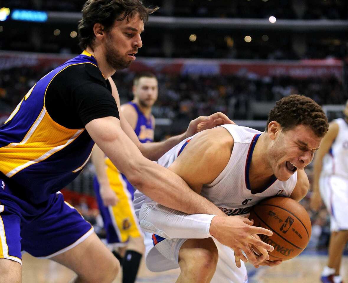 Clippers power forward Blake Griffin is fouled by Lakers power forward Pau Gasol during the game Saturday night at Staples Center.