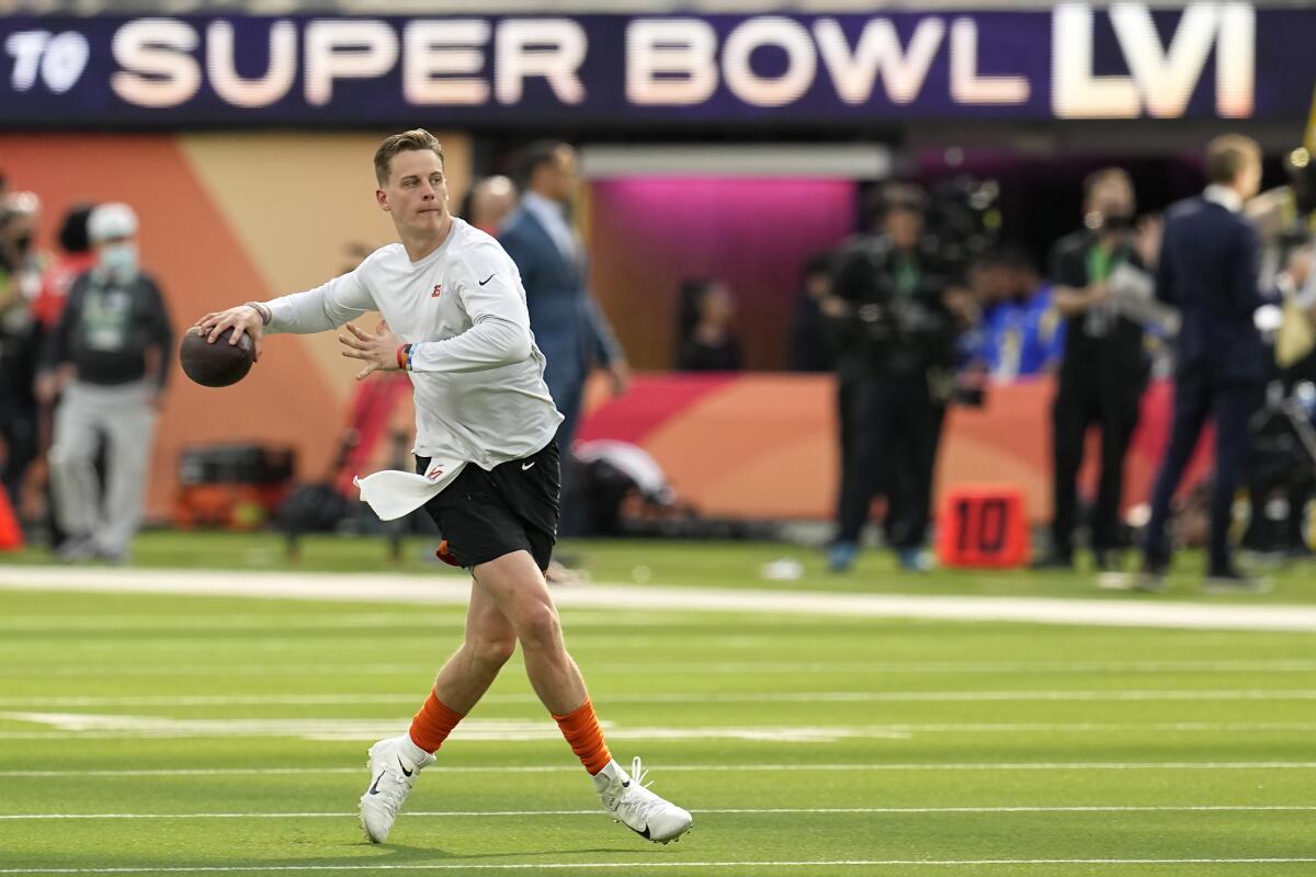 Cincinnati Bengals quarterback Joe Burrow warms up at SoFi Stadium before Super Bowl LVI on Sunday.