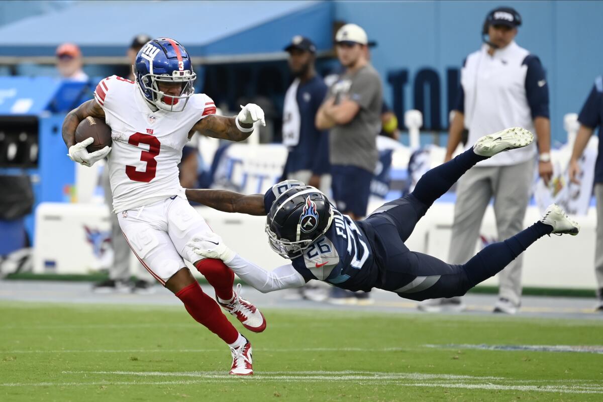 New York Giants wide receiver Sterling Shepard (3) makes a catch as he breaks away from Tennessee Titans cornerback Kristian Fulton (26) for a touchdown during the second half of an NFL football game Sunday, Sept. 11, 2022, in Nashville. (AP Photo/Mark Zaleski)