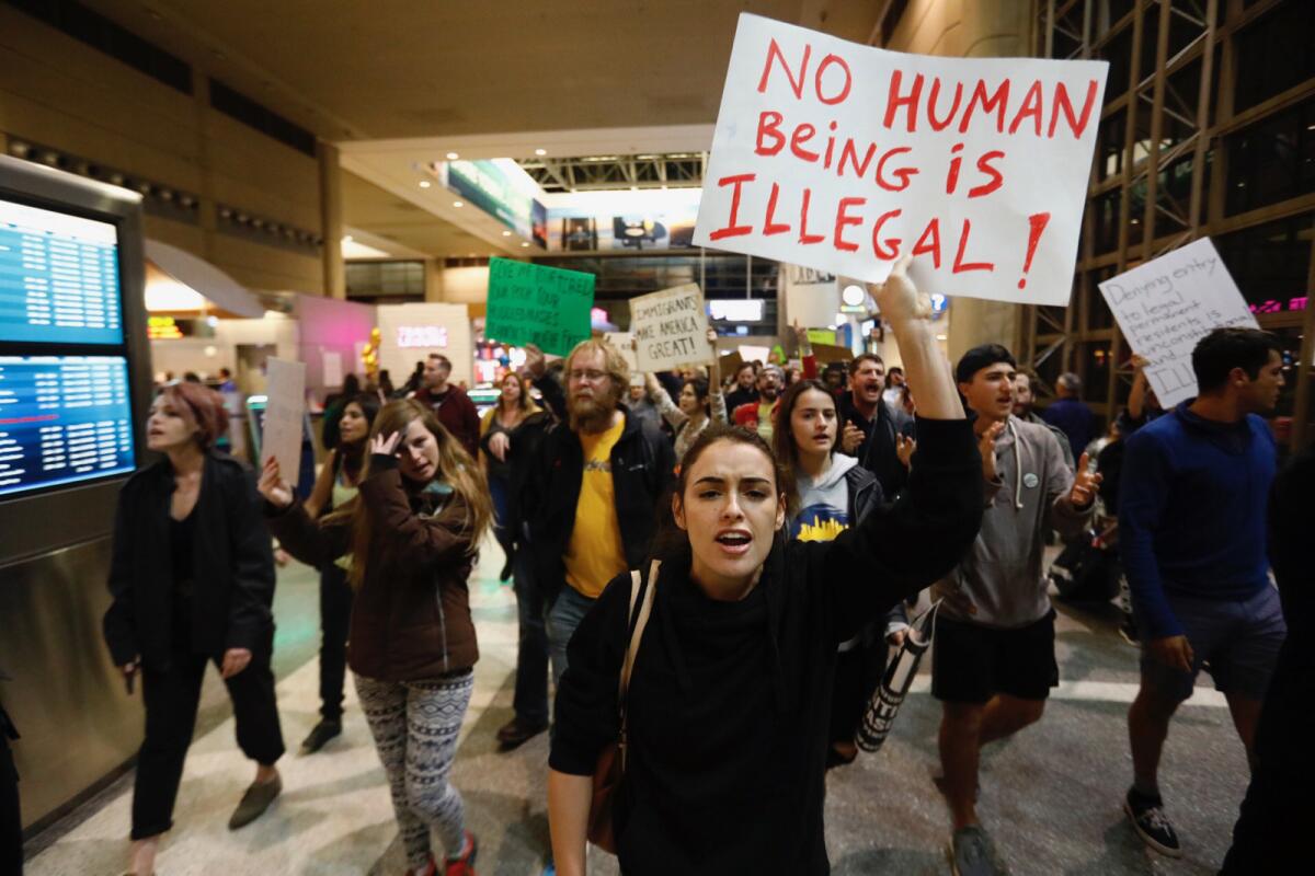 Hundreds march inside the Tom Bradley International Terminal at LAX in January to protest President Trump's immigration order.