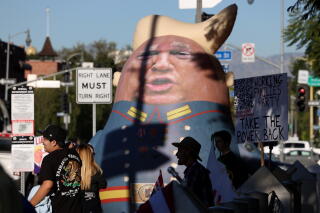 an inflatable doll of Trump in a Russian military outfit