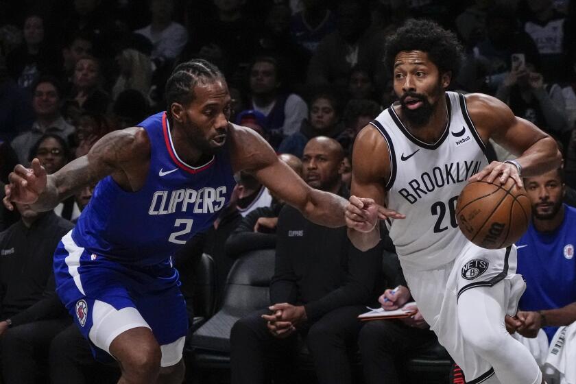 Brooklyn Nets' Spencer Dinwiddie (26) drives past LA Clippers' Kawhi Leonard (2) during the first half of an NBA basketball game Wednesday, Nov. 8, 2023, in New York. (AP Photo/Frank Franklin II)