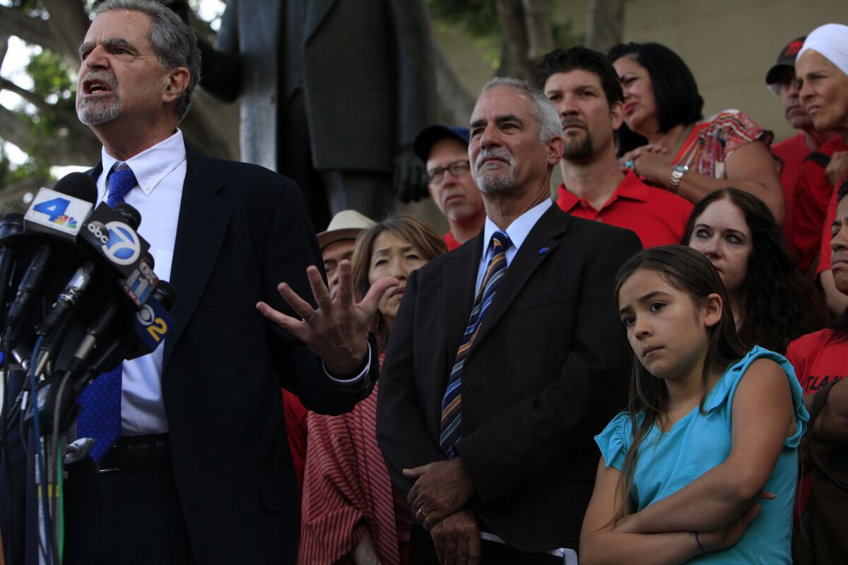 Attorney Glenn Rothner speaks during a news conference outside the Stanley Mosk Courthouse in Los Angeles after a Superior Court judge ruled Tuesday that key job protections for California teachers violate the state's constitution.