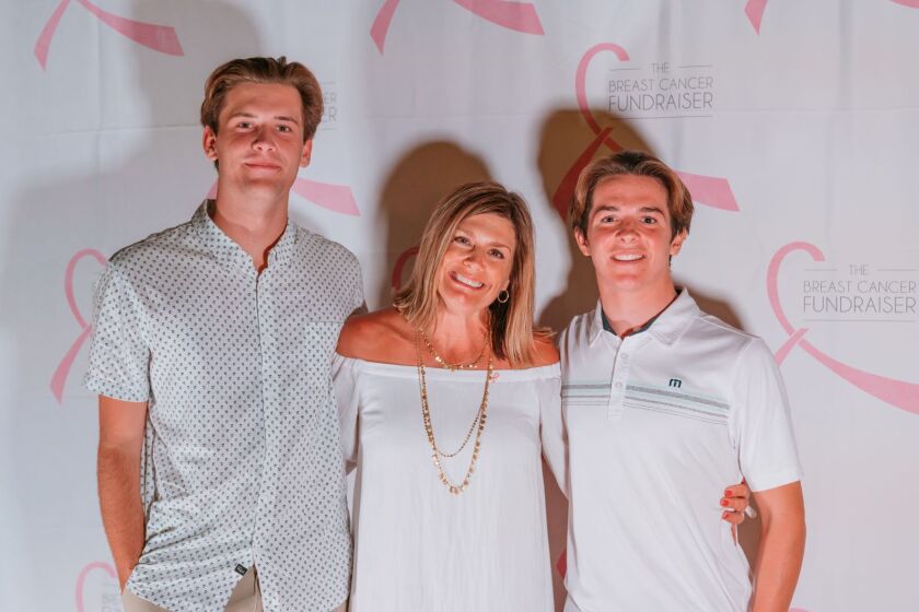 Cori Armstrong, center, a breast cancer survivor and honoree, with Jack Devlin, left, and her son Jack Armstrong at the 14th annual Orange County Breast Cancer Fundraiser event.
