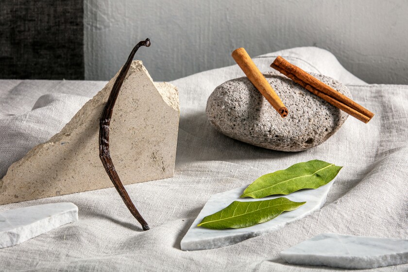 Flavorings for jam: vanilla bean, cinnamon stick and bay leaves.