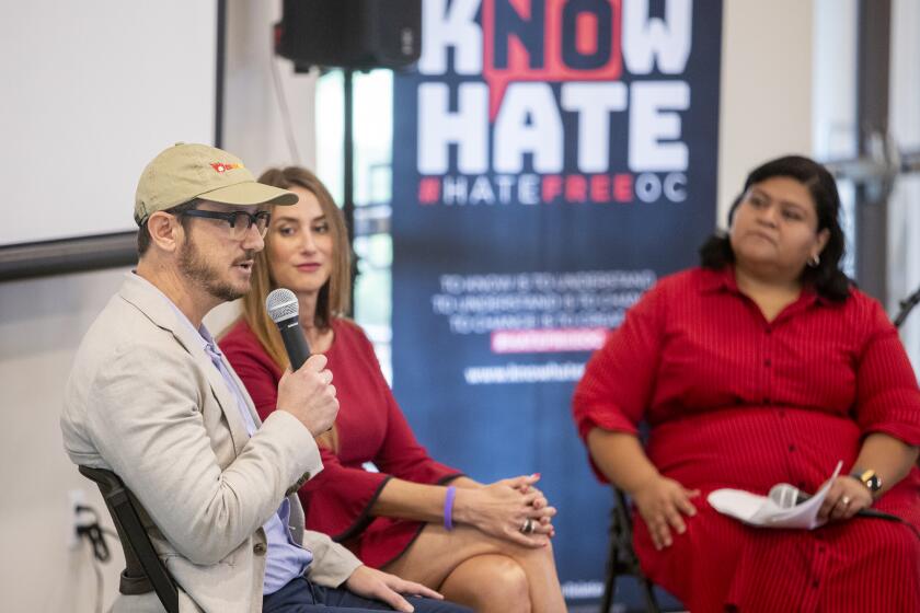 Gideon Berstein and Jeanne Pepper Bernstein, the parents of Blaze Bernstein who was stabbed to death in January 2018, speak during the OC Human Relations Council's annual hate crime report release event at the Los Olivos Community Center in Irvine on Thursday, September 26.