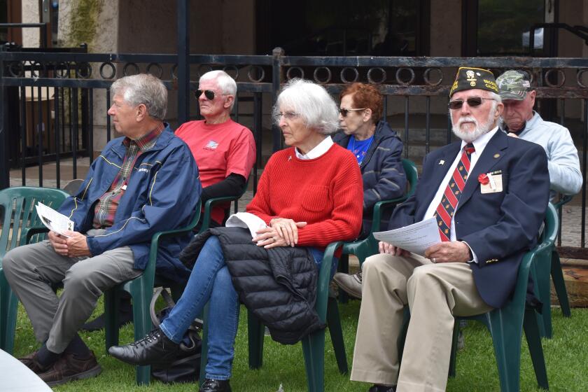 Retired Navy officer Tom Lettington, far right, presented a wreath during Rancho Bernardo’s Memorial Day ceremony.
