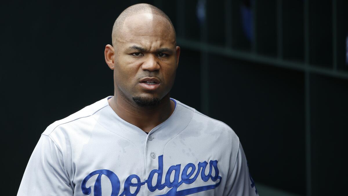 Dodgers outfielder Carl Crawford walks through the dugout during a game against the Philadelphia Phillies in May. Will the Dodgers look to deal Crawford before the trade deadline?