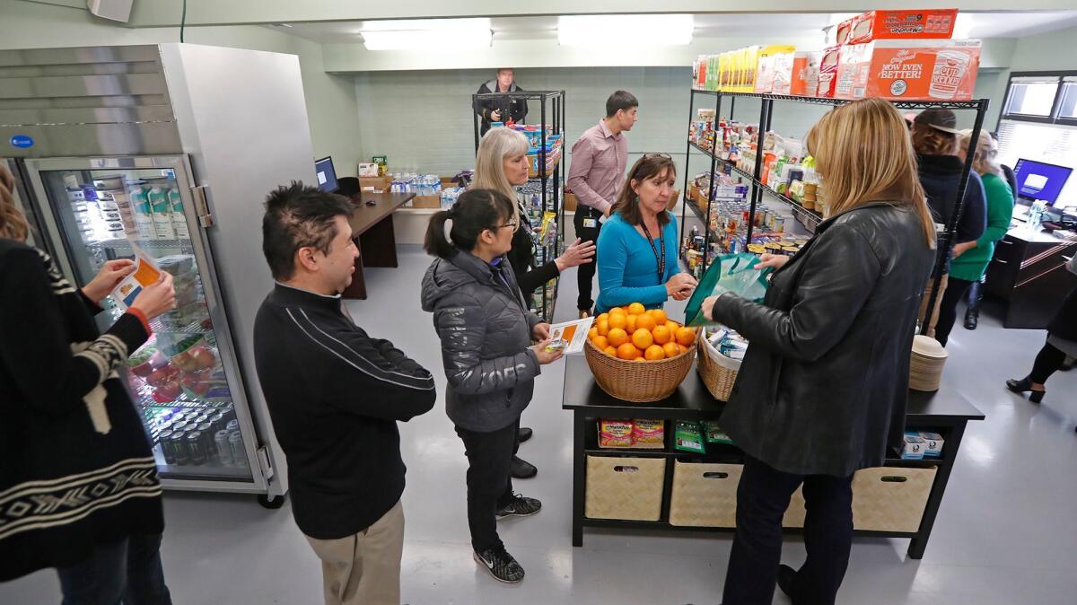 Guests explore Pirates' Cove, a new food pantry at Orange Coast College in Costa Mesa.
