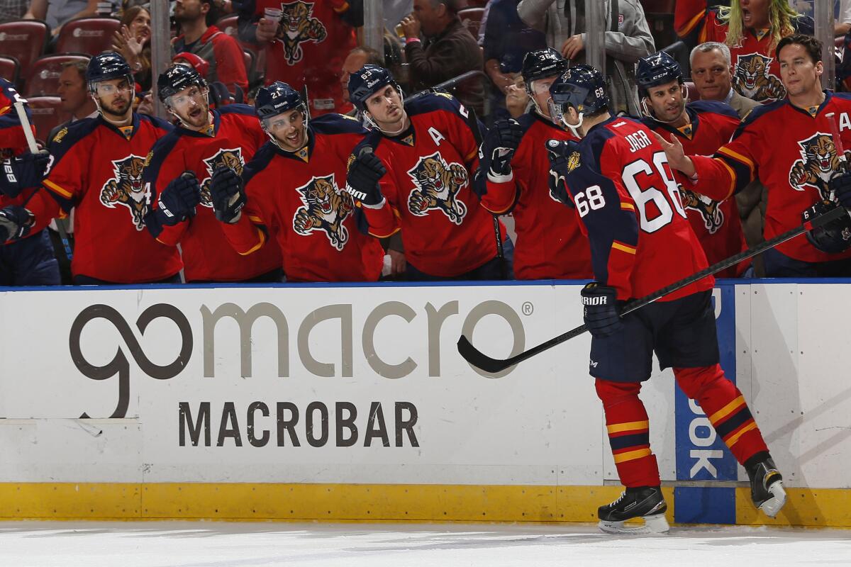 Forward Jaromir Jagr is congratulated by teammates after scoring against the Red Wings. Jagr is now fifth all time in goals scored.