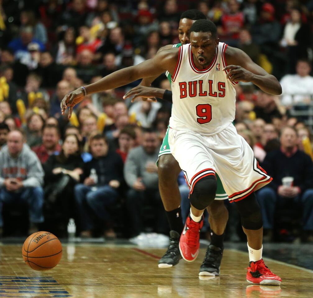 Luol Deng makes a steal during the second half against the Celtics.