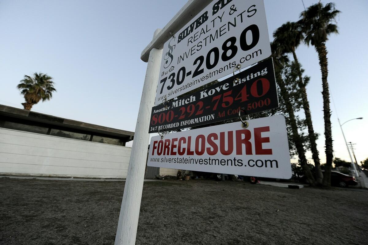 A foreclosure sign stands in front of a bank-owned home in Las Vegas in 2010.
