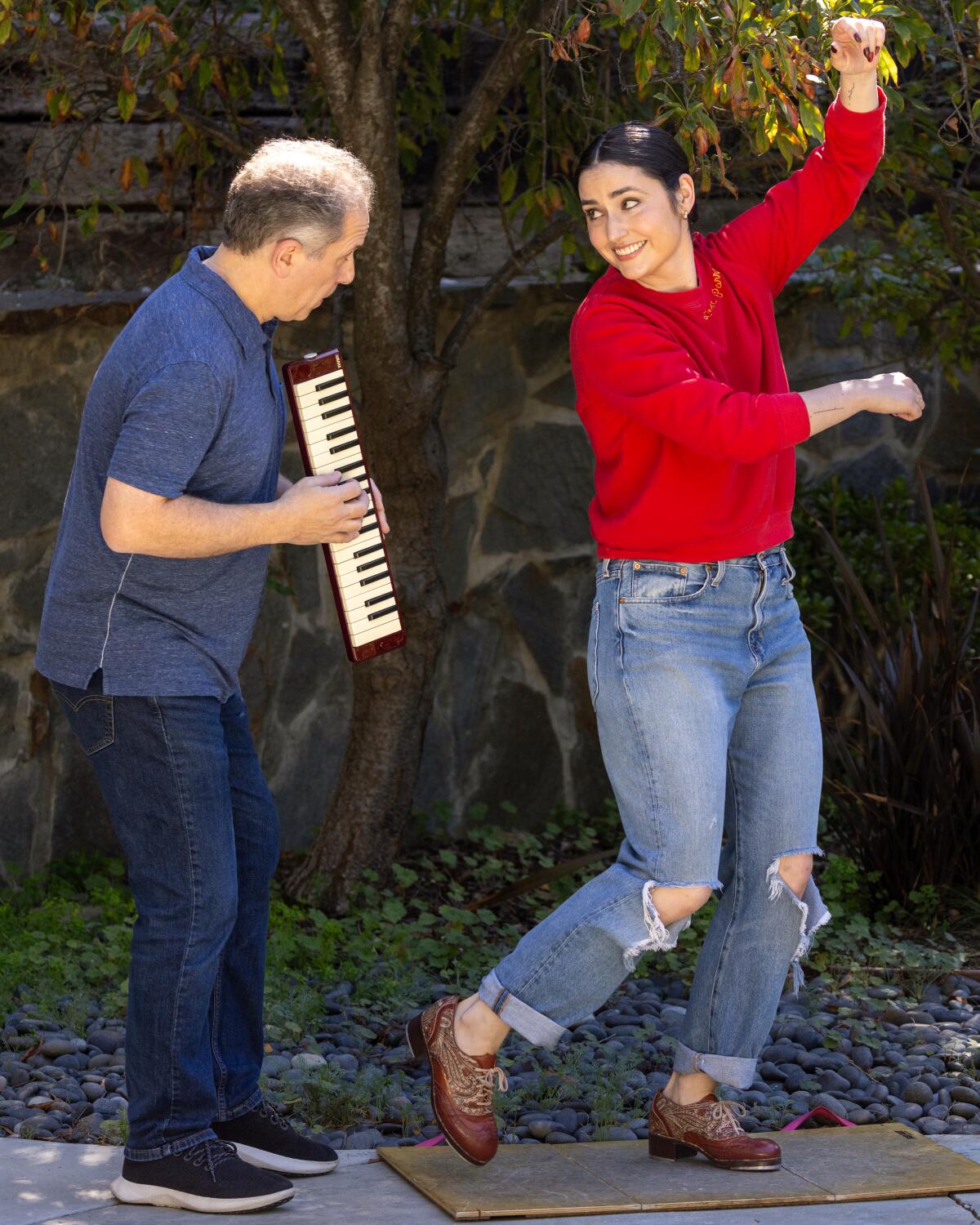 Tap dancer Melinda Sullivan and jazz pianist Larry Goldings practice their musical performance together.