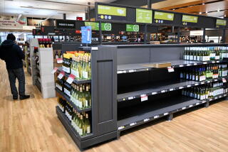 Empty space on shelves where American-made wine had been at the Societe Des Alcools Du Quebec (SAQ) store in Montreal, Quebec, Canada, on Wednesday, March 5, 2025. Prime Minister Justin Trudeau is not open to lifting Canada's full package of retaliatory tariffs if US President Donald Trump leaves any tariffs on Canada in place, according to a senior Canadian government official. Photographer: Graham Hughes/Bloomberg