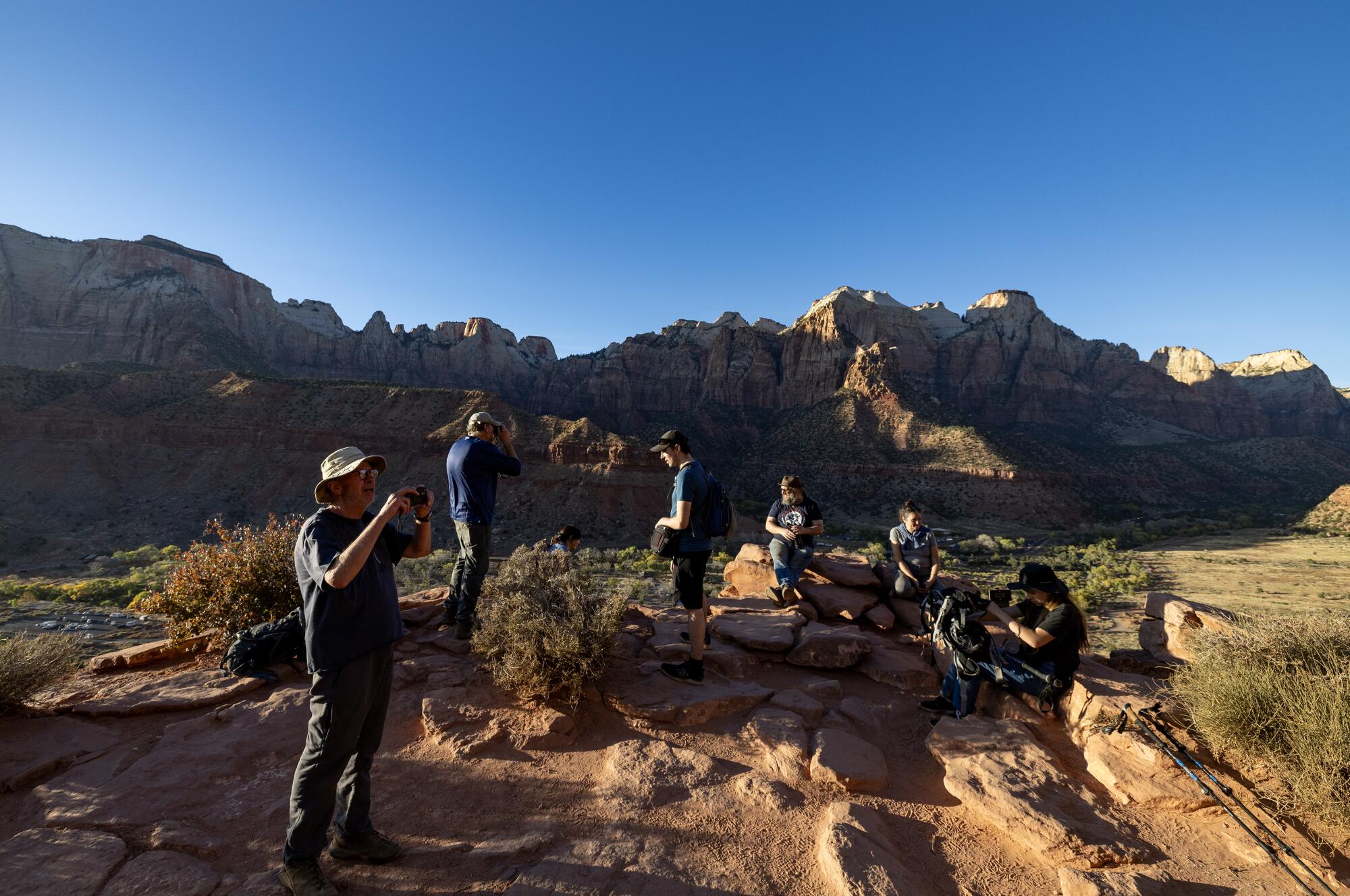  Members and friends of Atheists United take in the view while resting along the Watchman Trail 