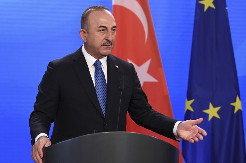 Turkish Foreign Minister Mevlut Cavusoglu gives a statement to the media following a meeting with German Foreign Minister Heiko Maas at the foreign ministry in Berlin, Germany May 6, 2021. (Annegret Hilse/Pool via AP)