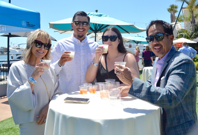 Karri Yee, from left, Austin Cervantes, Barrett Yee and Jordan Yee enjoy the Newport Beach Wine & Spirits Festival.