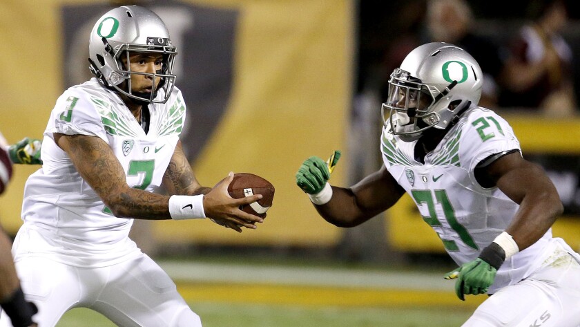 Quarterback Vernon Adams Jr. (3) and running back Royce Freeman (21) have the Oregon offense clicking on all cylinders as the season comes to a conclusion.