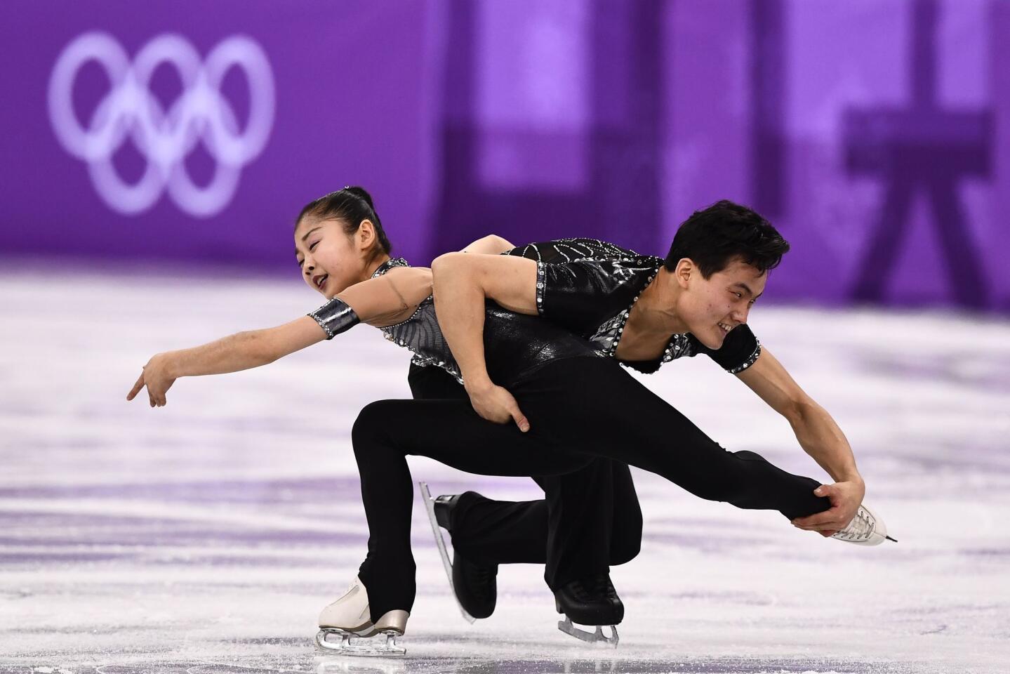 North Korea's Ryom Tae Ok (front) and North Korea's Kim Ju Sik hug after competing in the pair skating short program of the figure skating event during the Pyeongchang 2018 Winter Olympic Games at the Gangneung Ice Arena in Gangneung on February 14, 2018. / AFP PHOTO / Roberto SCHMIDTROBERTO SCHMIDT/AFP/Getty Images ** OUTS - ELSENT, FPG, CM - OUTS * NM, PH, VA if sourced by CT, LA or MoD **
