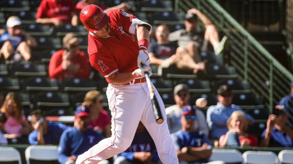 Angels slugger Mike Trout hits against the Texas Rangers on Thursday.