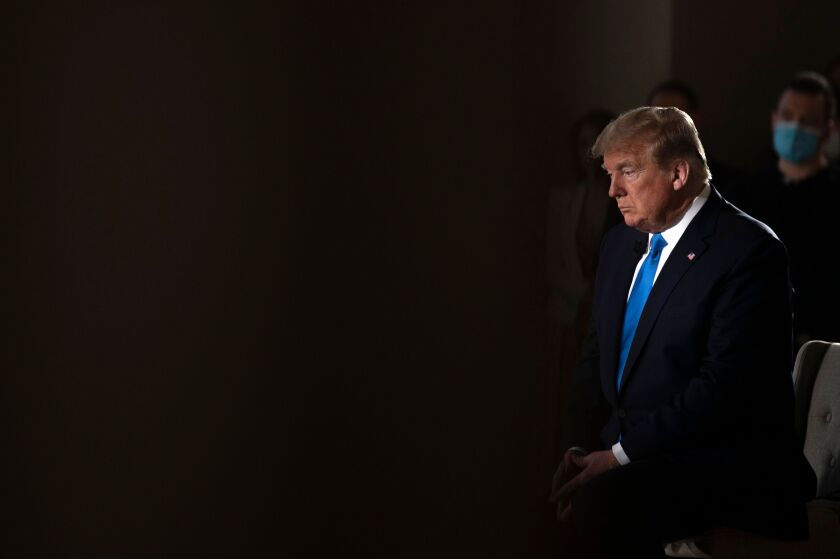 President Trump waits for the end of a commercial break during a Fox News virtual town hall on May 3.